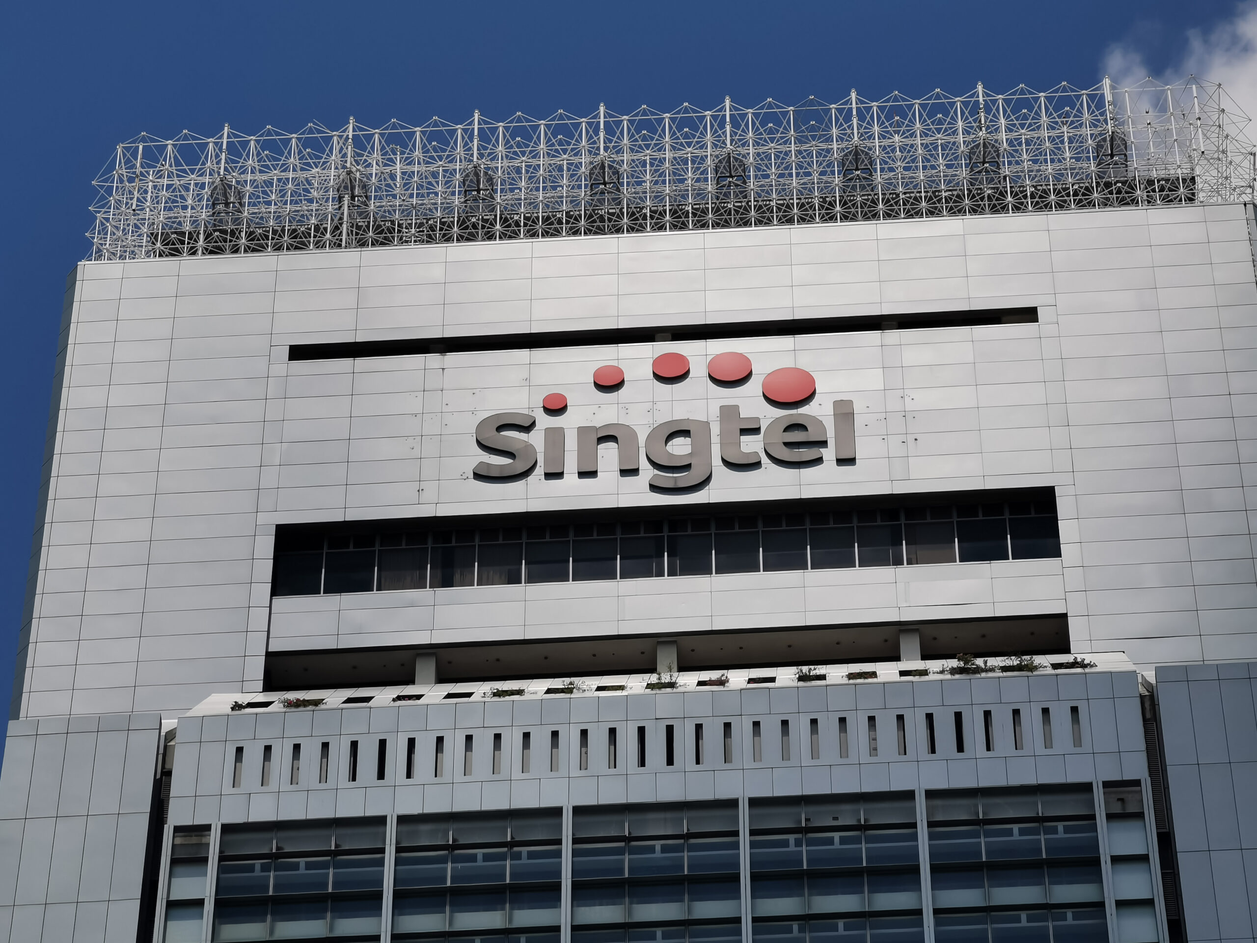 SingTel’s annual profit plunges by over 50% due to a US$2.3 billion impairment charge